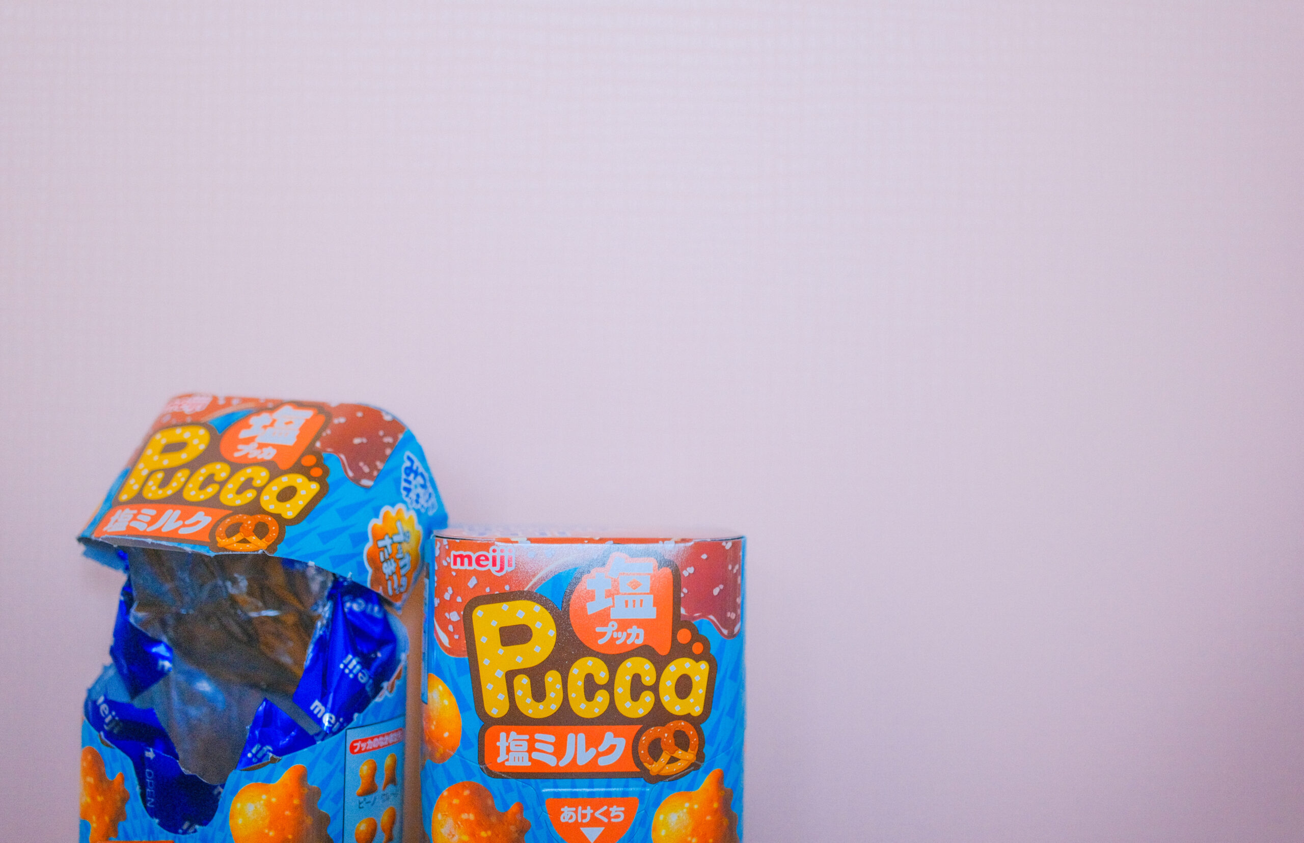 Meiji Pucca Salted Milk Japanese snack package and chocolate